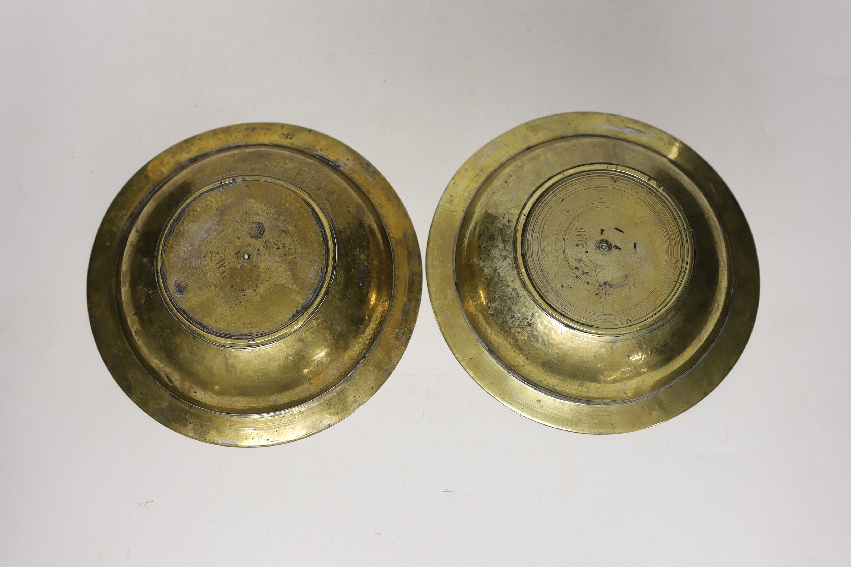 A pair and another inlaid brass dishes, Cairo ware, largest 19cm
